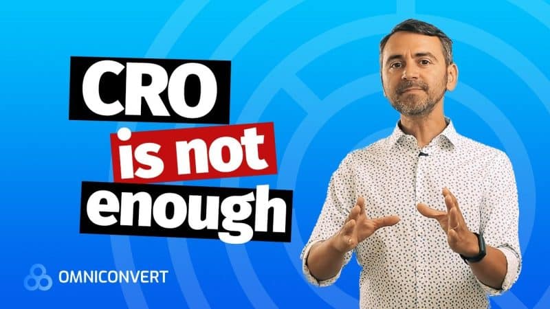 Man standing next to text that says "CRO is not enough" with Omniconvert logo.