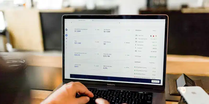 A person analyzing e-commerce performance metrics on a laptop.