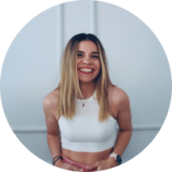 Lisa-Popovici A woman smiling in a white crop top, promoting ecommerce brands.