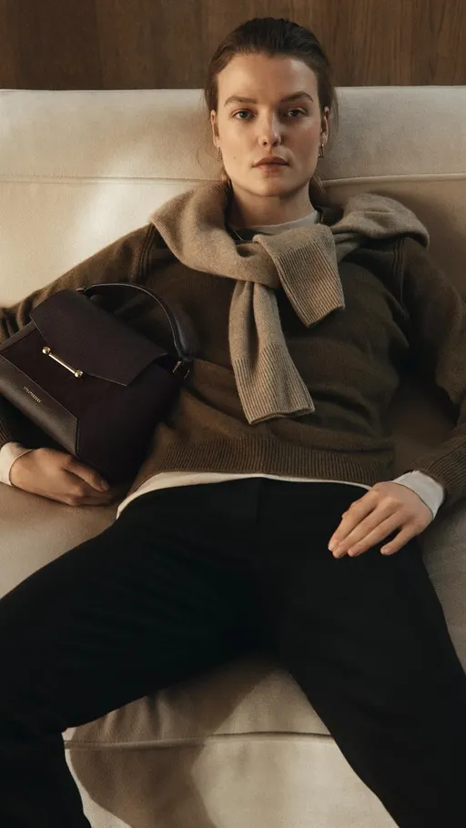 strathberry.com ad: A symphony of suede. Turn the volume up.