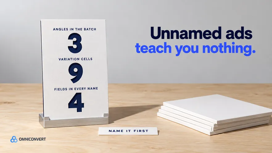 A single matte-white ad board standing in a machined aluminium easel on a pale birch sign-shop bench under hard studio light, three figures die-cut clean through it over a navy backing card, beside a short stack of identical unnamed blank boards