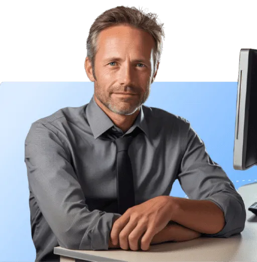 A man sitting in front of a computer.
